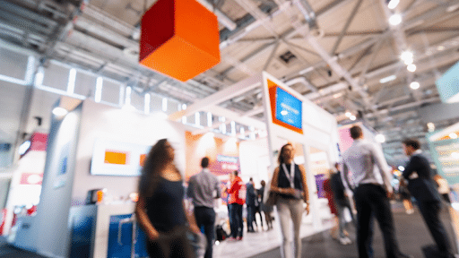 people walking around tradeshow exhibit